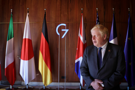 PM in front of the G7 flags