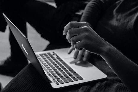 Woman working on laptop.