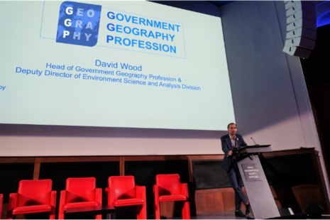 David Wood, Head of Government Geography Profession standing behind a lecturn at the GGP conference 2022