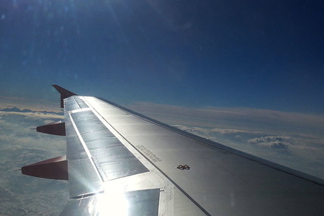 Passenger airplane wing in flight.