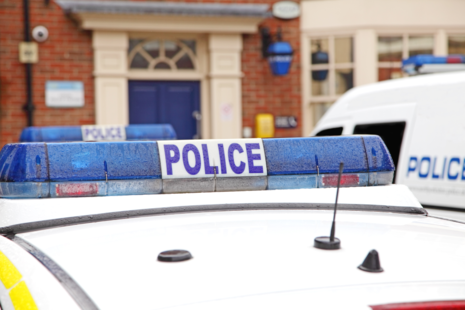 A police car at a police station.