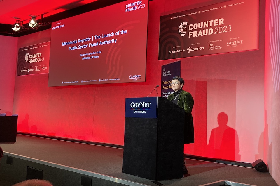 Baroness Neville-Rolfe speaking at the lectern