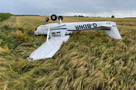 Figure 1  After hitting a hedge, the aircraft came to rest upside down