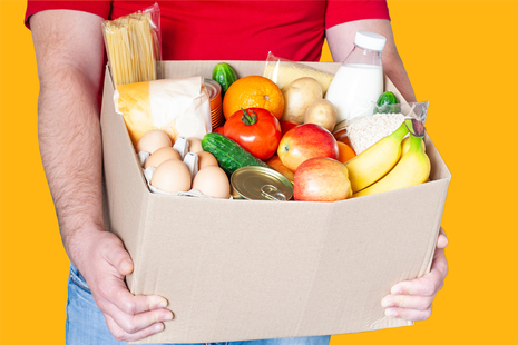 Stock image of person carrying food in box