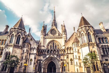 The exterior of the Royal Courts of Justice - a large building in Gothic Revival style. 