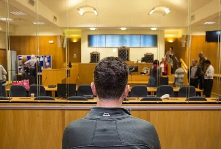 Man in the dock facing a panel at a Magistrates' Court