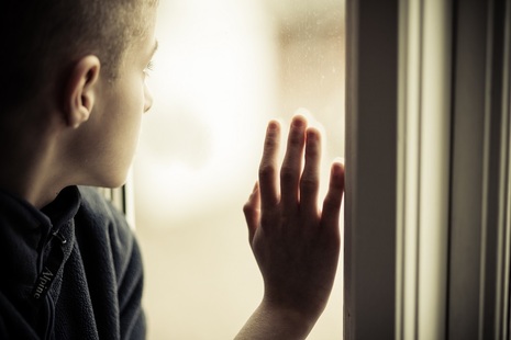 Vulnerable child at window