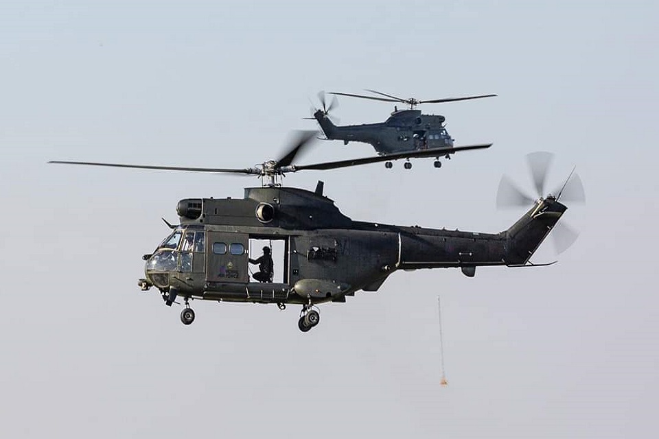 Picture shows 2 RAF Puma in the sky on route to return to their home in Oxfordshire. 