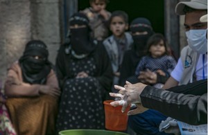 A healthworker demonstrates handwashing techniques to protect against coronvirus in Yemen. Picture: UNICEF