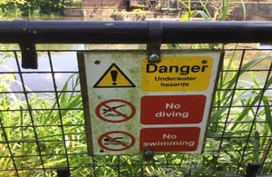 A picture of an Environment Agency warning sign on a structure.