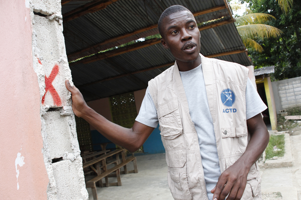 An ACTED engineer assesses an earthquake-damaged building in Leogane. Picture: DFID/Russell Watkins