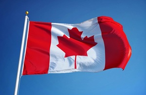 Canadian Flag Against Blue Sky