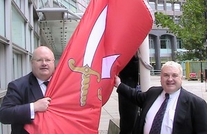 Eric Pickles and Russell Grant hold the Essex flag