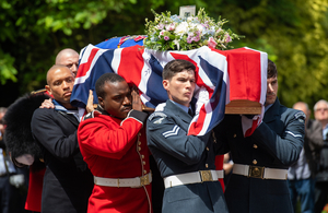 Military personnel from the Royal Navy, Army and Royal Air Force carry Dame Vera Lynn's coffin, which is draped in a Union Flag