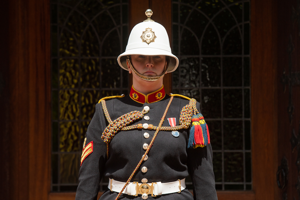 Corporal Kimberley Hare of the Royal Marines is shown standing outside the funeral venue in ceremonial uniform