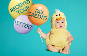 Image of a child holding some balloons that display the words "Received your tax credits letter?"