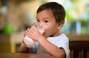 Young child drinking milk