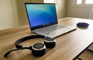 Laptop and headphones on desk
