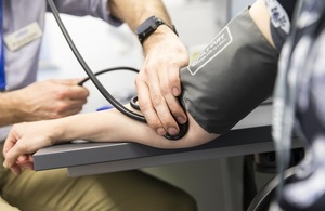 Doctor using a stethoscope on a patient