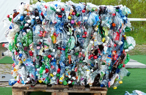A large cube of flattened plastic bottles set to be recycled
