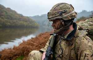 Picture showing Army personnel looking over a river crossing