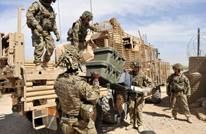 British soldiers load a Wolfhound vehicle with equipment from Checkpoint Abpashak East [Picture: Corporal Si Longworth, Crown copyright]