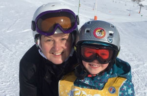 Lieutenant Sally Ashlin with her son in ski on the slopes.