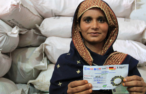 Rahat Amanhuhha holds the voucher that entitles her to vital seeds and fertiliser. Picture: Vicki Francis/DFID