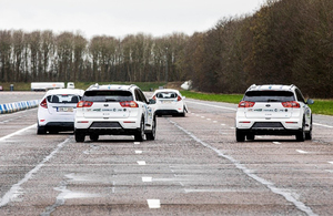 Automated cars steering around a stationary vehicle.