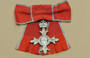 MBE (Member of the most Excellent Order of the British Empire) insignia.