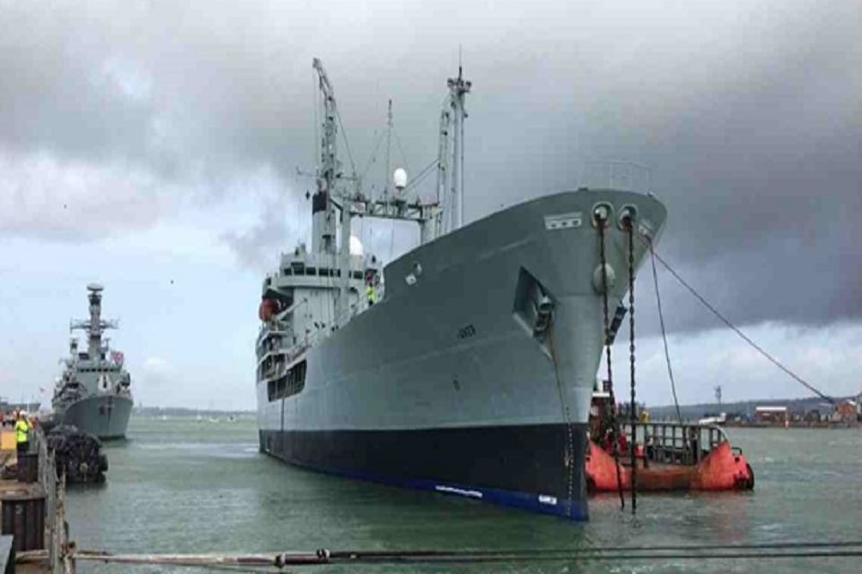 Black Rover in profile with lots of ropes as it is being prepared for towing.
