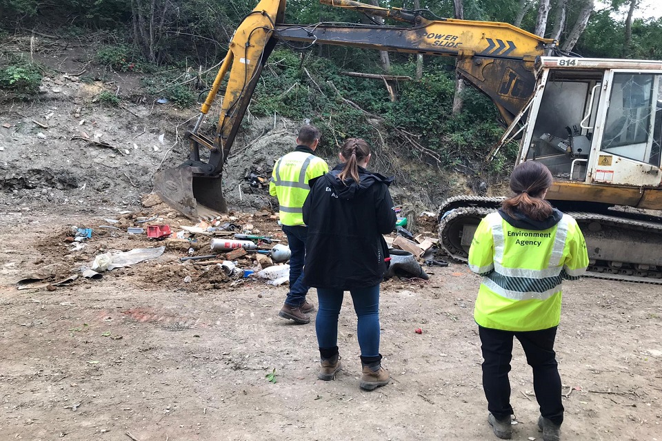 Officers inspecting the Abbey Skips site.