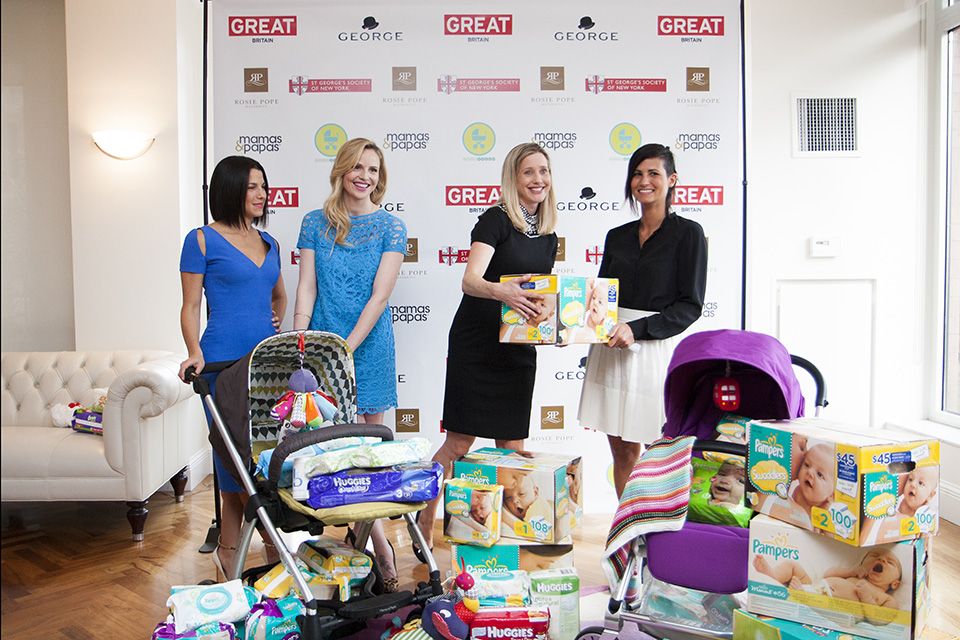 Jessica Seinfeld of Baby Buggy, Rosie Pope, Susan Lopez and Olivia Robinson of Mamas and Papas pose with the donated items.