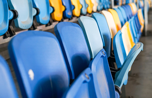Image of multi coloured seats in sports stadium
