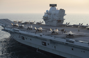 Image depicts the HMS Queen Elizabeth aircraft carrier.