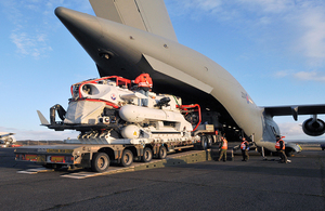 Image depicts the NSRS pod being loaded onto a aircraft.