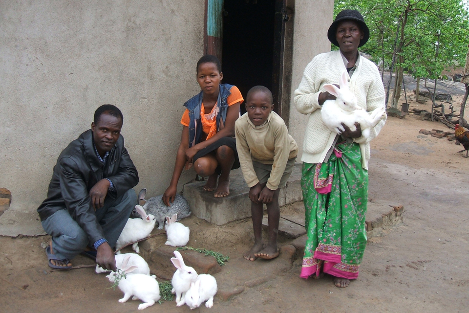 Gogo Kerina (far right) with her family and her rabbits. Picture: DFID