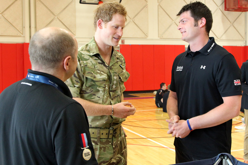 Prince Harry speaks with Martin Colclough and Captain David Henson