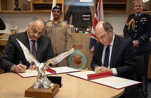 Image depicts Defence Secretary Ben Wallace signing the Statement of Intent with His Excellency Dr Khalid bin Mohamed Al Attiyah, Deputy Prime Minister and Minister of State for Defence Affairs.