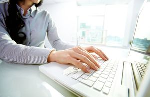 woman typing on laptop