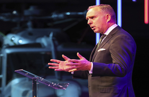 Image depicts Lord Mark Sedwill speaking on stage at the Atlantic Future Forum.