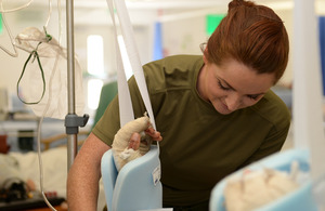 Corporal Jennie Cottrell treats a patient at Camp Bastion military hospital [Picture: Sergeant Barry Pope, Crown copyright]