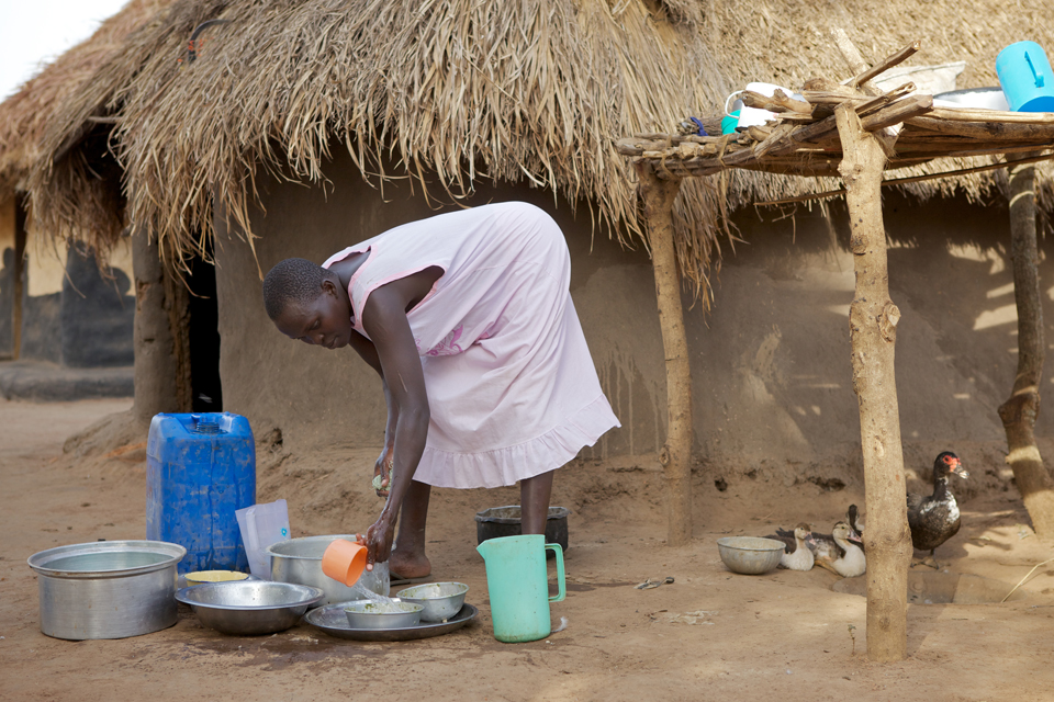 Elizabeth uses the water to wash her pots and pans. Picture: Richard Wainwright/CAFOD