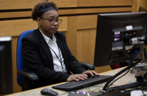 Court clerk working on computer