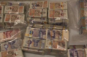 Two charged after cash stuffed into suitcases seized at Heathrow airport article