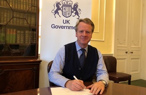 image of the Secretary of State for Scotland, Alister Jack, signing the Ayrshire Growth Deal