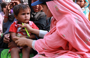 A female doctor with the International Medical Corps examines a young boy at a mobile health clinic in the village of Goza, near Dadu, in Pakistan's Sindh province. Picture: Russell Watkins/DFID