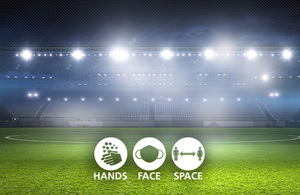 Hands Face Space branded asset with a view of a floodlit sports stadium