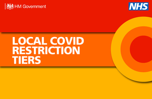 A banner that says 'local COVID restriction tiers'.