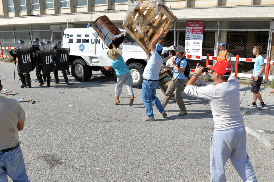 The reservists face an angry mob during training in Cyprus